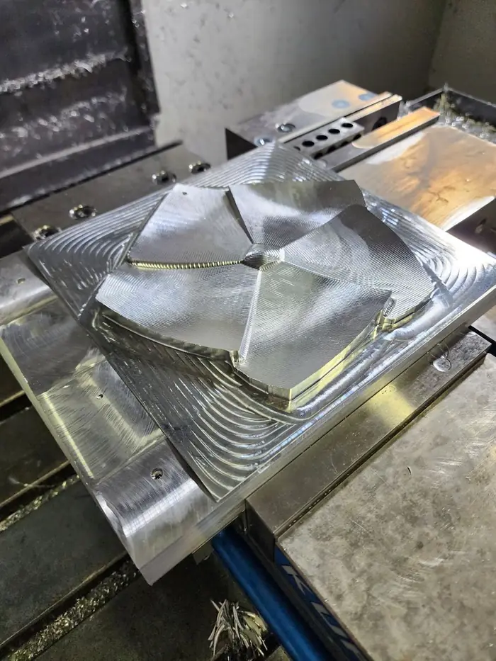 A machined panel in raw aluminum before finishing