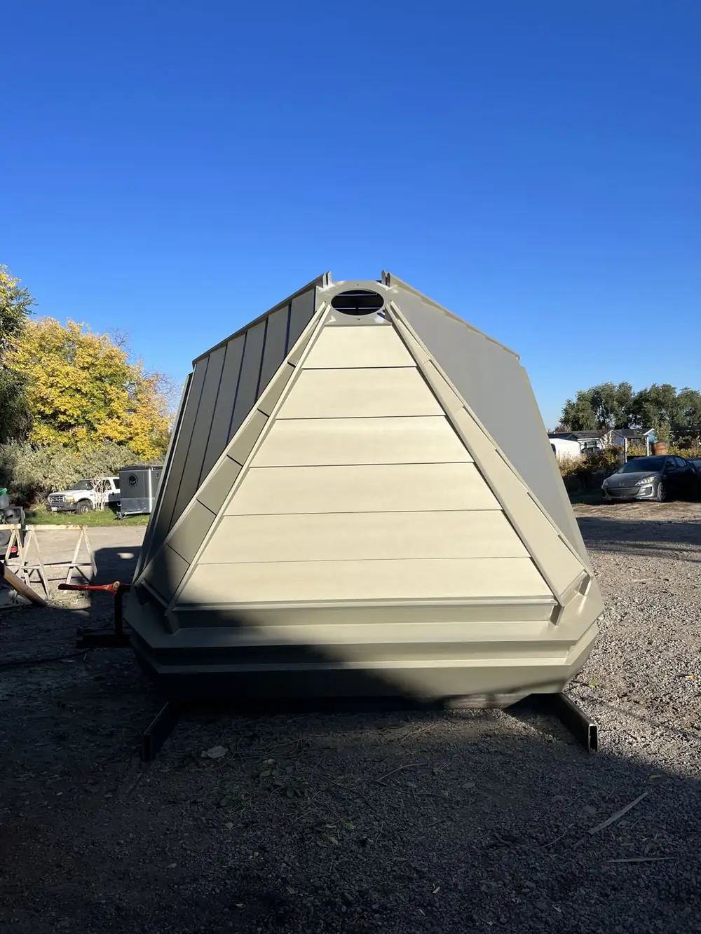 The finished painted aluminum cupola sitting on its custom shipping frame outside the shop
