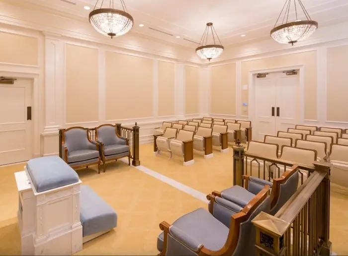 Bronze rail with ornamental balusters installed in a finished instruction room at the Raleigh temple