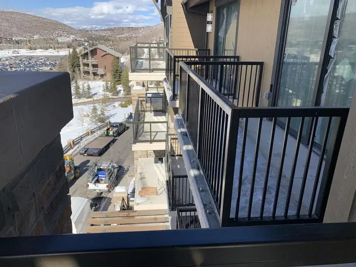 Completed balcony guardrail with the valley beyond